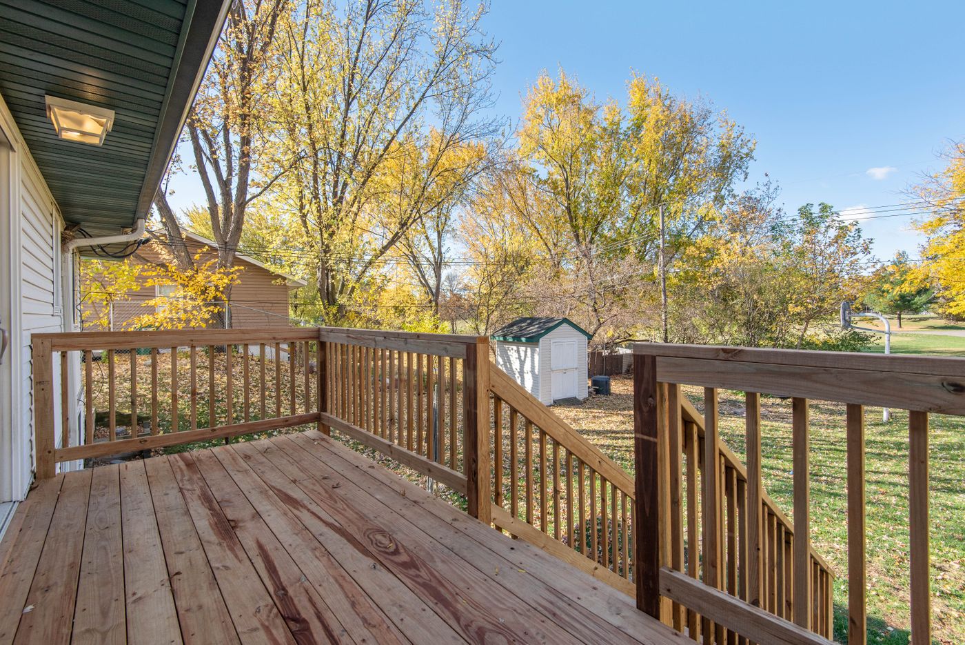 A wooden deck attached to a house.
