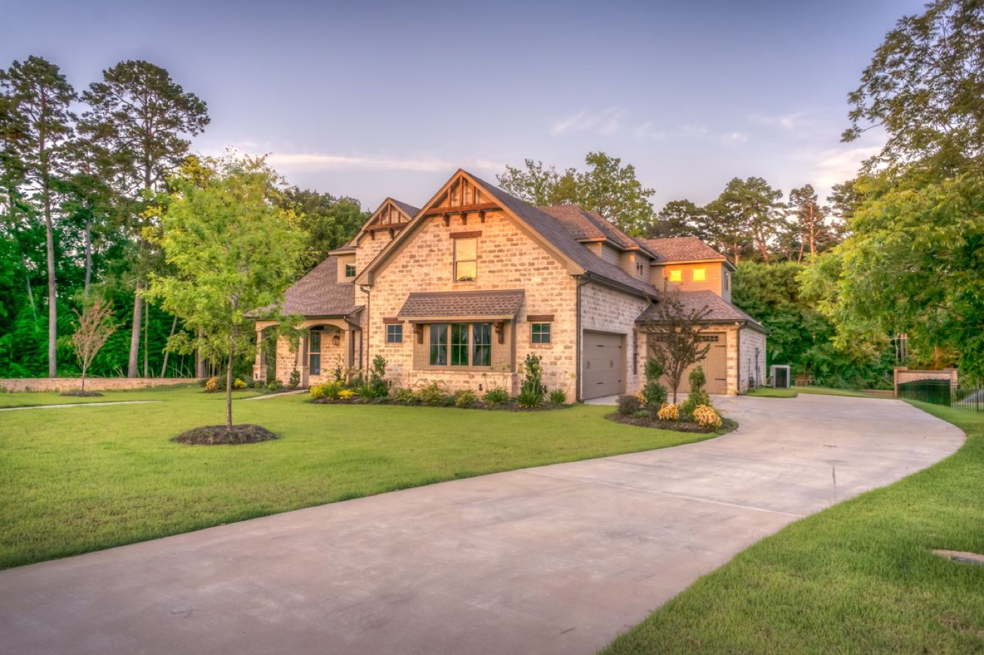 A newly built two-story home with a landscaped yard.